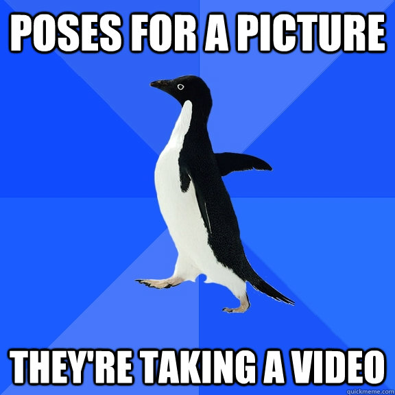 poses for a picture they're taking a video  Socially Awkward Penguin