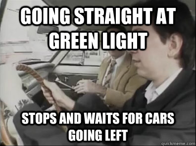 Going straight at green light STOPS and waits for cars going left  