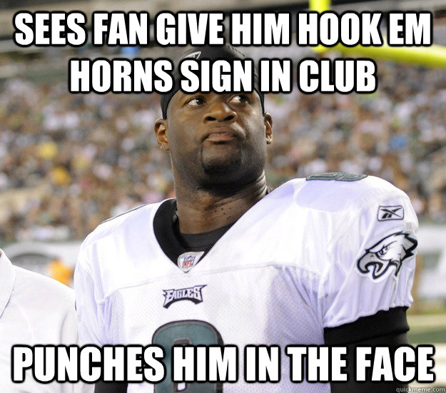Sees fan give him Hook Em Horns sign in club punches him in the face  Vince Young