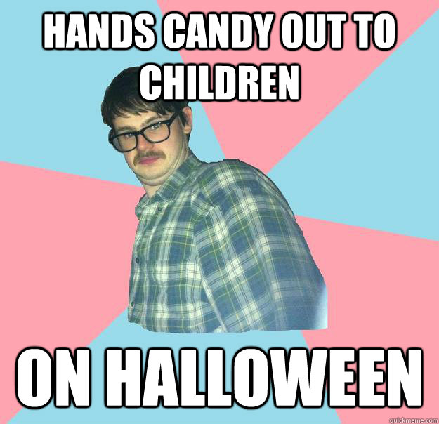 Hands candy out to children on halloween  