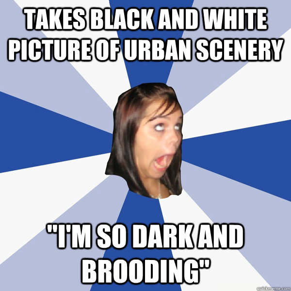 takes black and white picture of urban scenery 