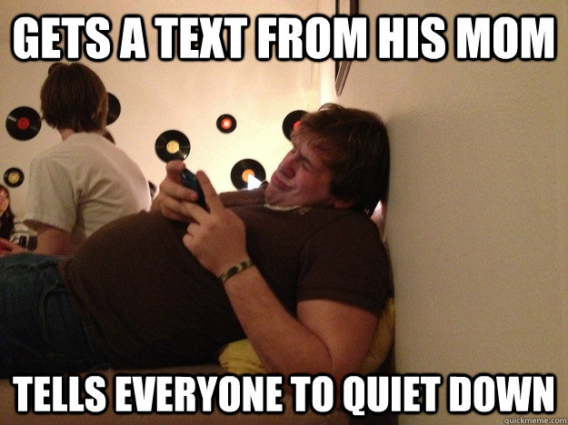 Gets a text from his mom Tells everyone to quiet down  