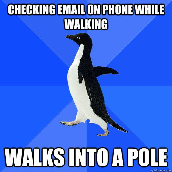 checking email on phone while walking walks into a pole  Socially Awkward Penguin