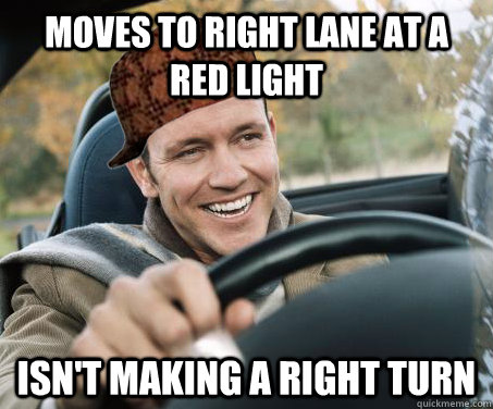 Moves to right lane at a red light isn't making a right turn  SCUMBAG DRIVER