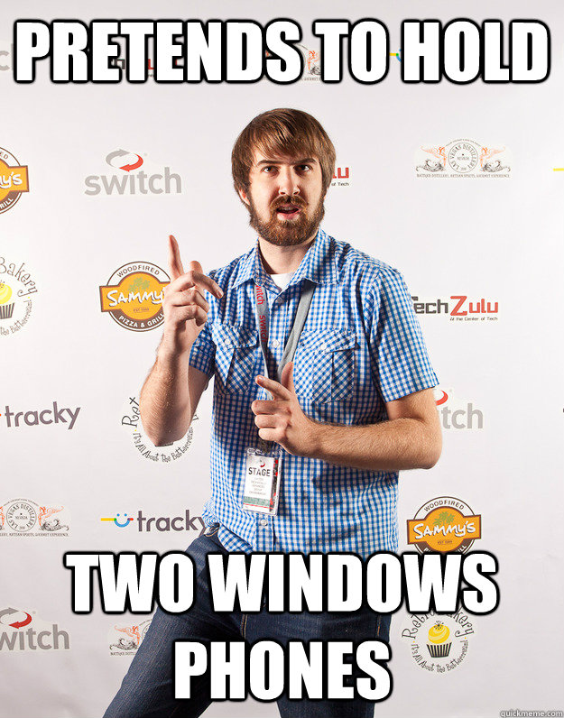 Pretends to hold two windows phones  Awkward Mark Johnson