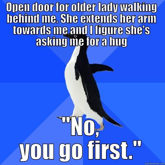 OPEN DOOR FOR OLDER LADY WALKING BEHIND ME. SHE EXTENDS HER ARM TOWARDS ME AND I FIGURE SHE'S ASKING ME FOR A HUG 