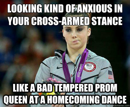 Looking kind of anxious in your cross-armed stance
 Like a bad tempered prom queen at a homecoming dance  Not impressed