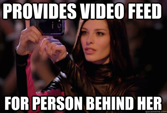 Provides video feed for person behind her  Dumbass T-Mobile Girl