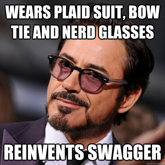 wears plaid suit, bow tie and nerd glasses reinvents swagger  