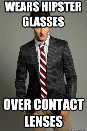 wears hipster glasses over contact lenses  Hamilton Hypocrite