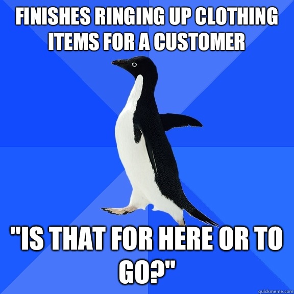 Finishes ringing up clothing items for a customer 