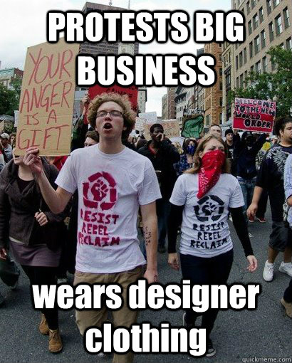 PROTESTS BIG BUSINESS wears designer clothing  