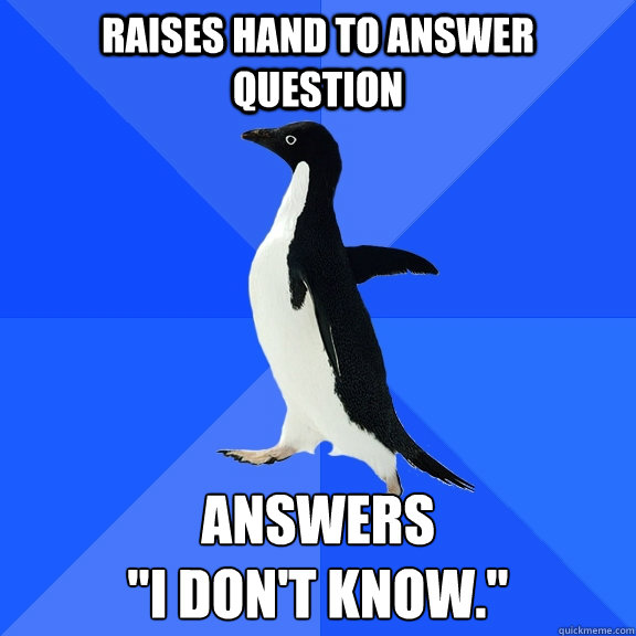 Raises hand to answer question Answers 
