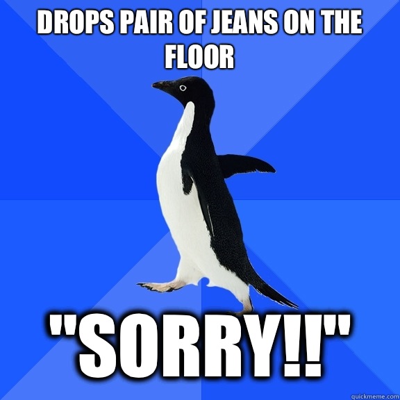 Drops pair of jeans on the floor 