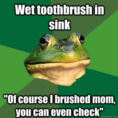 Wet toothbrush in sink 