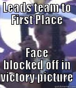 LEADS TEAM TO FIRST PLACE FACE BLOCKED OFF IN VICTORY PICTURE Misc