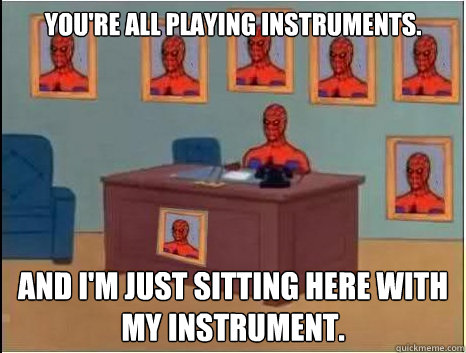 You're all playing instruments. And I'm just sitting here with my instrument.  desk spiderman