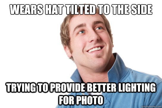 WEARS HAT TILTED TO THE SIDE TRYING TO PROVIDE BETTER LIGHTING FOR PHOTO  Misunderstood D-Bag