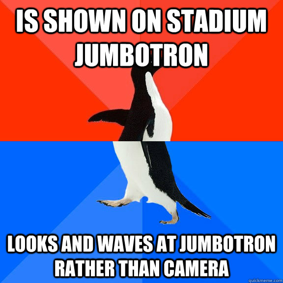 is shown on stadium jumbotron looks and waves at jumbotron rather than camera   Awesome Awkward Penguin