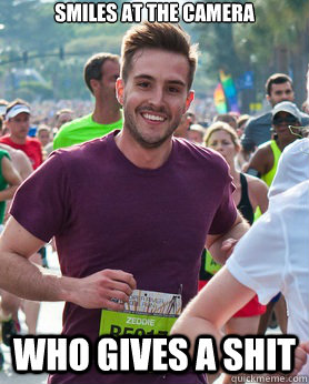 Smiles at the camera Who gives a shit  Ridiculously photogenic guy