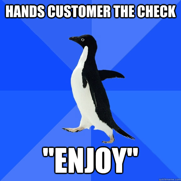 Hands customer the check 