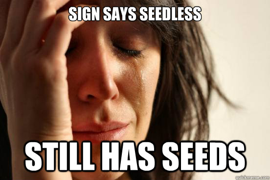 Sign says seedless still has seeds  First World Problems