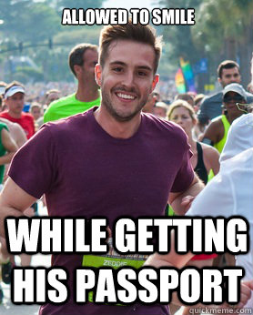 Allowed to smile while getting his passport  Ridiculously photogenic guy