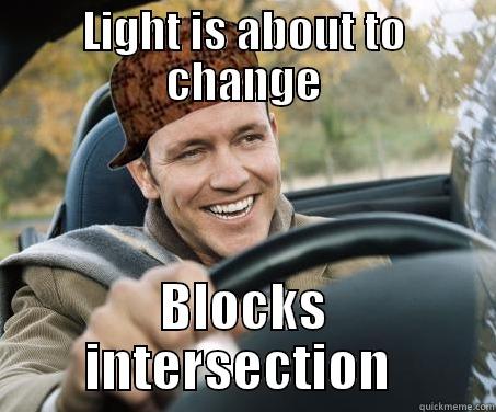 Scumbag Driver Red light changes - LIGHT IS ABOUT TO CHANGE BLOCKS INTERSECTION  SCUMBAG DRIVER