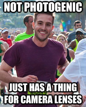 Not photogenic Just has a thing for camera lenses  Ridiculously photogenic guy