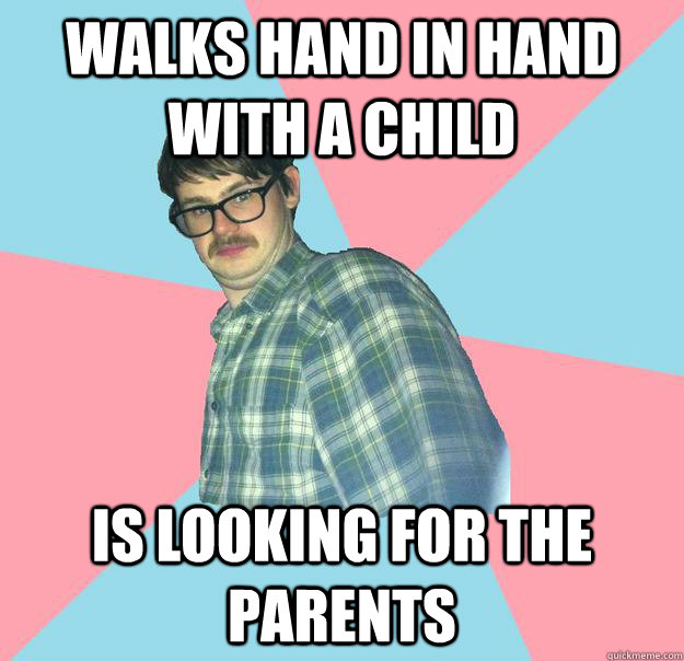 Walks hand in hand with a child Is looking for the parents  