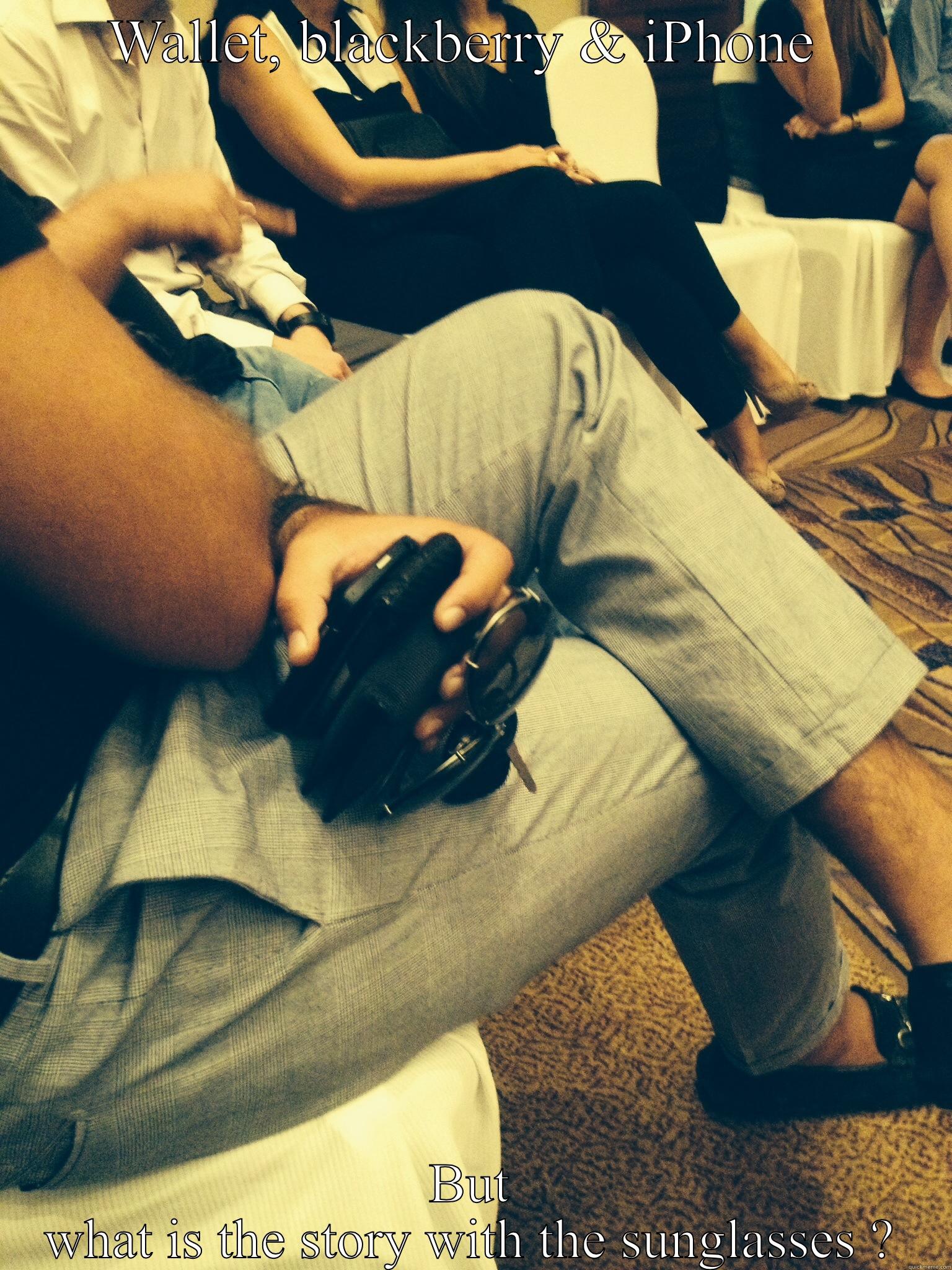 WALLET, BLACKBERRY & IPHONE  BUT WHAT IS THE STORY WITH THE SUNGLASSES ? Misc