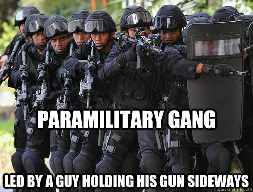 Paramilitary Gang Led by a guy holding his gun sideways  Tough Swat team