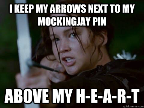 I keep my arrows next to my mockingjay pin above my h-e-a-r-t - I keep my arrows next to my mockingjay pin above my h-e-a-r-t  Pi Phi Katniss