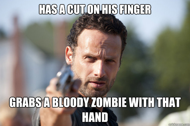 has a cut on his finger grabs a bloody zombie with that hand  