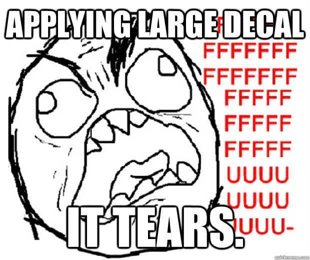Applying large decal It tears.  Rage Guy