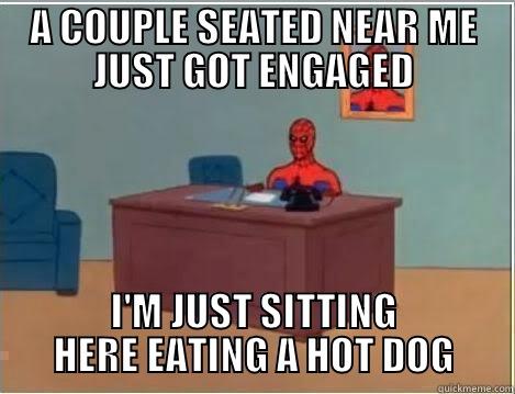 A COUPLE SEATED NEAR ME JUST GOT ENGAGED I'M JUST SITTING HERE EATING A HOT DOG Spiderman Desk
