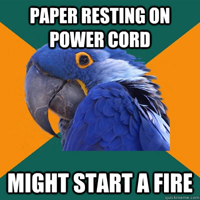 paper resting on power cord might start a fire  Paranoid Parrot