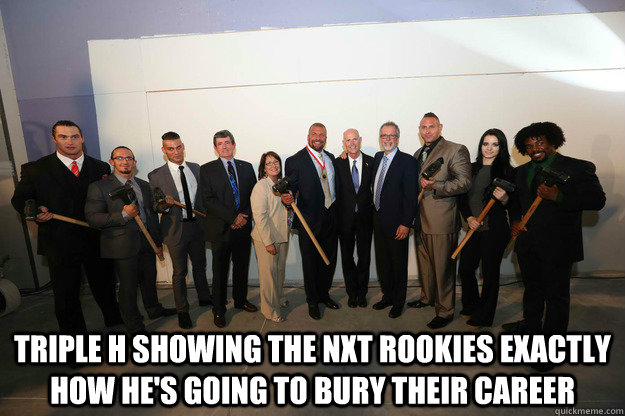  Triple H showing the NXT Rookies exactly how he's going to bury their career  Triple H Bury