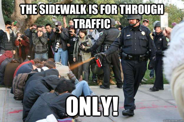 The sidewalk is for through traffic only! - The sidewalk is for through traffic only!  Overzealous traffic cop