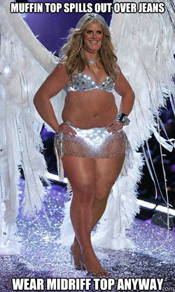 muffin top spills out over jeans wear midriff top anyway  Typical American Woman