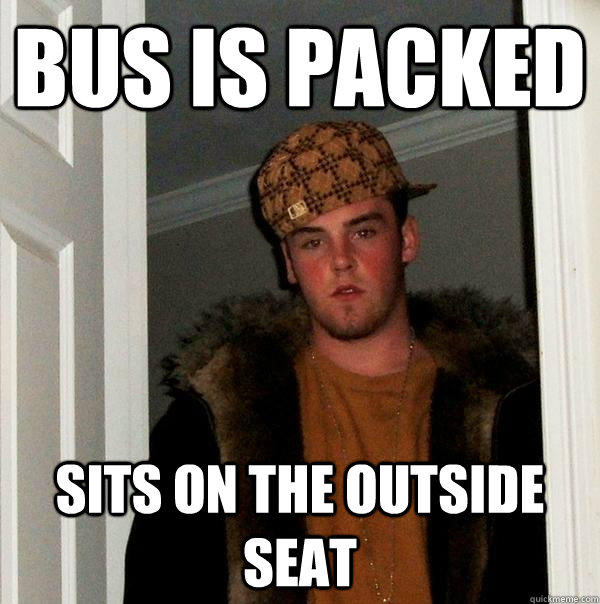 bus is packed sits on the outside seat  