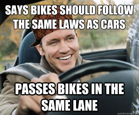 says bikes should follow the same laws as cars passes bikes in the same lane  SCUMBAG DRIVER