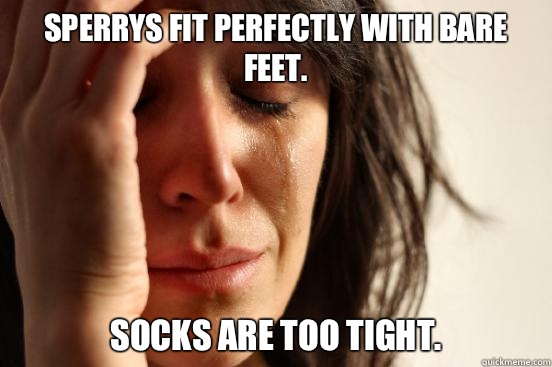 Sperrys fit perfectly with bare feet.  Socks are too tight.   First World Problems