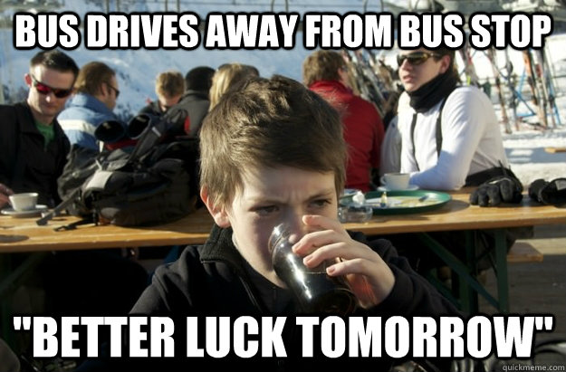 bus drives away from bus stop 