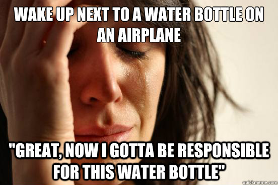 wake up next to a water bottle on an airplane 