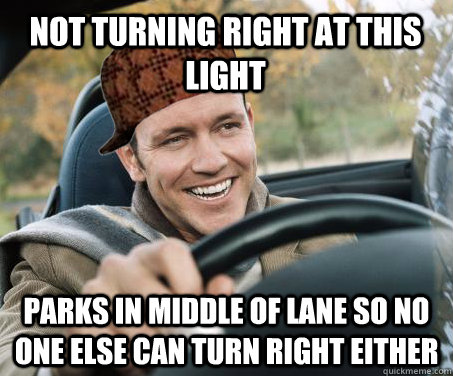 Not turning right at this light parks in middle of lane so no one else can turn right either  SCUMBAG DRIVER