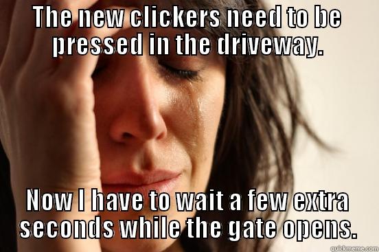 THE NEW CLICKERS NEED TO BE PRESSED IN THE DRIVEWAY. NOW I HAVE TO WAIT A FEW EXTRA SECONDS WHILE THE GATE OPENS. First World Problems