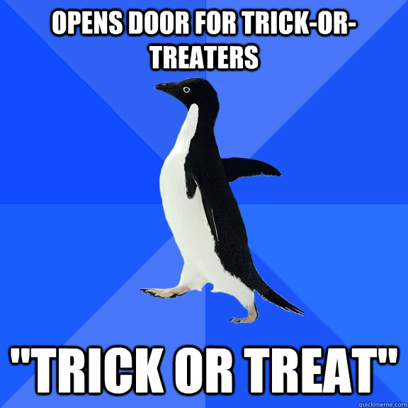 opens door for trick-or-treaters 