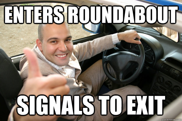 enters roundabout signals to exit  