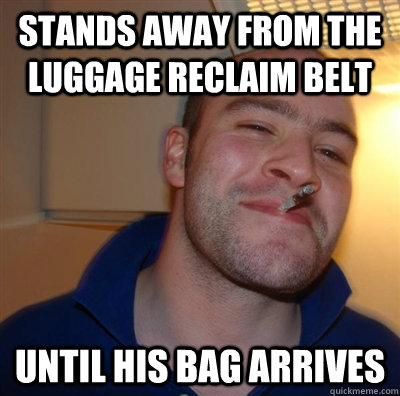 Stands away from the luggage reclaim belt until his bag arrives  